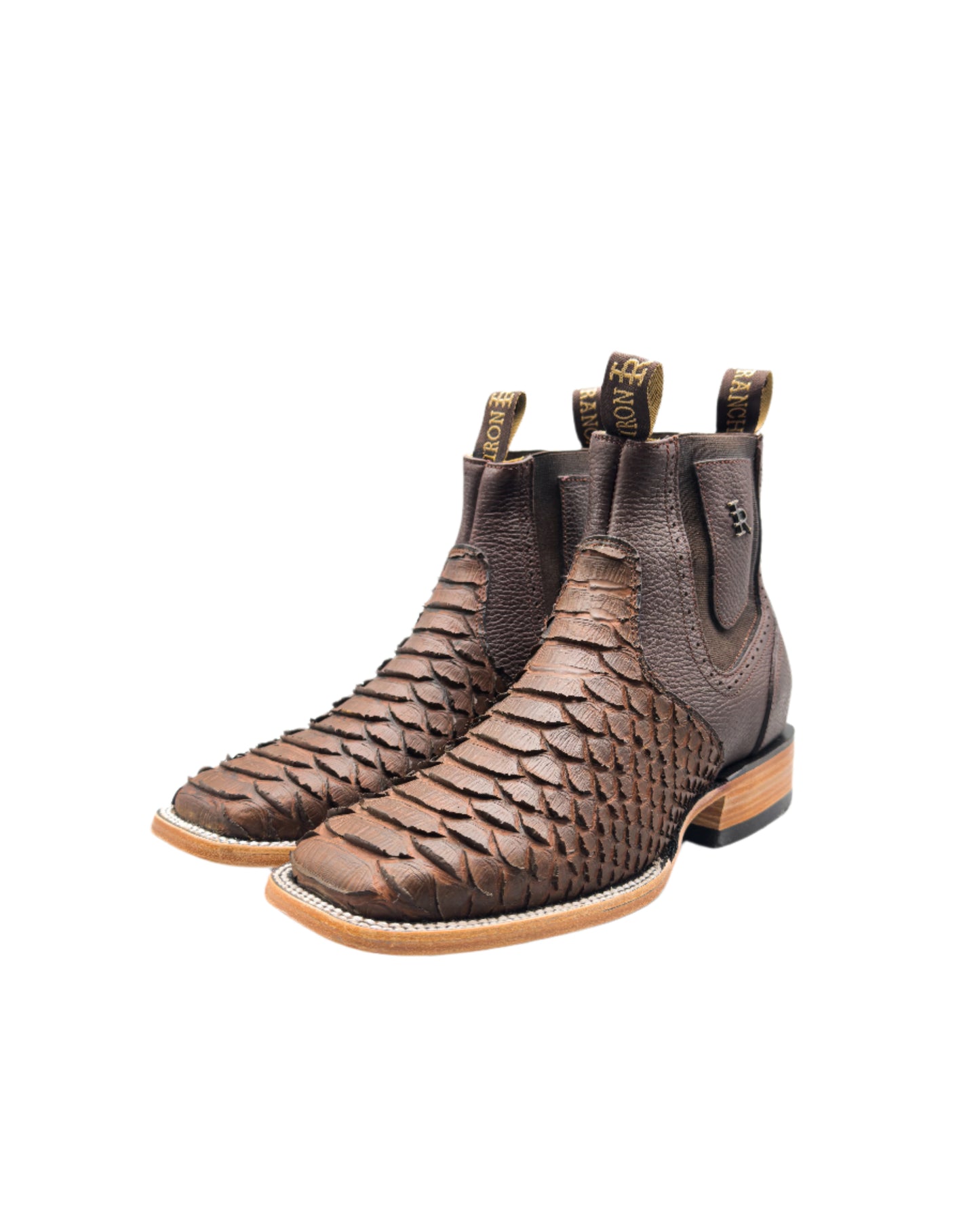 Pair of python brown leather cowboy boots botines Chelsea boots with white background